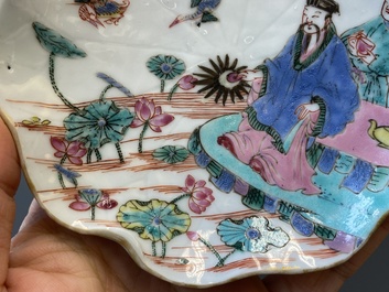 A pair of Chinese relief-decorated famille rose 'lotus' cups and saucers with a scholar and his servant, Yongzheng