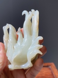 A fine Chinese white jade carving of a Buddha's hand on wooden stand, Qing