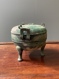 A Chinese archaic bronze tripod vessel and cover, 'ding', Eastern Zhou, Spring and Autumn period