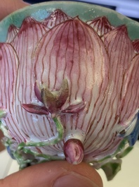 A pair of Chinese relief-decorated famille rose 'lotus' cups and saucers with a scholar and his servant, Yongzheng