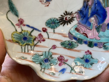 A pair of Chinese relief-decorated famille rose 'lotus' cups and saucers with a scholar and his servant, Yongzheng