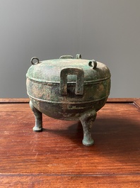 A Chinese archaic bronze tripod vessel and cover, 'ding', Eastern Zhou, Spring and Autumn period