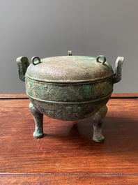 A Chinese archaic bronze tripod vessel and cover, 'ding', Eastern Zhou, Spring and Autumn period