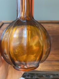 A Chinese translucent amber-coloured Peking glass bottle vase, Qianlong mark and of the period