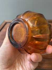 A Chinese translucent amber-coloured Peking glass bottle vase, Qianlong mark and of the period