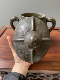 A Chinese archaic bronze ritual wine vessel and cover in Western Zhou-style, 'you', Ming