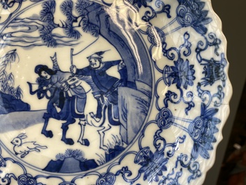 Three Japanese blue and white 'Mongolian hunt' plates in Chinese Kangxi-style, Edo, 18th C.