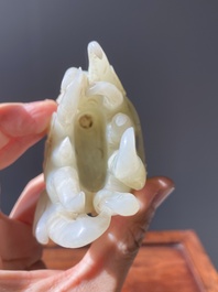 A fine Chinese white jade carving of a Buddha's hand on wooden stand, Qing