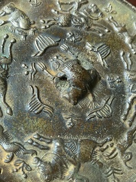 A Chinese bronze mirror, Ming