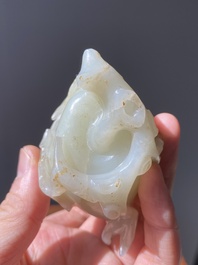 A fine Chinese white jade carving of a Buddha's hand on wooden stand, Qing