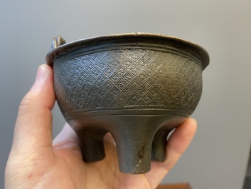 Two Chinese ritual bronze tripod food vessels, 'ding', Western Zhou and Yuan