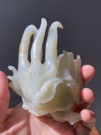 A fine Chinese white jade carving of a Buddha's hand on wooden stand, Qing