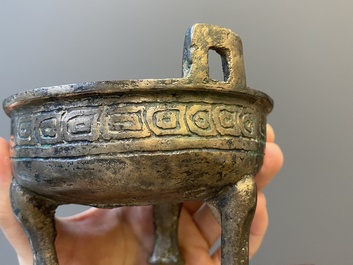 Two Chinese ritual bronze tripod food vessels, 'ding', Western Zhou and Yuan