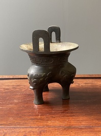 A Chinese archaic bronze tripod censer, 'ding', Ming