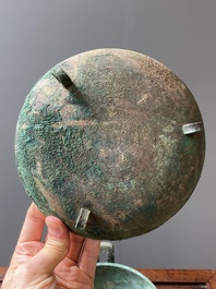 A Chinese archaic bronze tripod vessel and cover, 'ding', Eastern Zhou, Spring and Autumn period