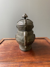 A Chinese archaic bronze ritual wine vessel and cover in Western Zhou-style, 'you', Ming