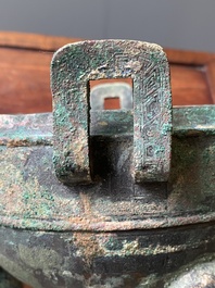 A Chinese archaic bronze tripod vessel and cover, 'ding', Eastern Zhou, Spring and Autumn period