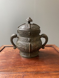 A Chinese archaic bronze ritual wine vessel and cover in Western Zhou-style, 'you', Ming