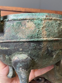 A Chinese archaic bronze tripod vessel and cover, 'ding', Eastern Zhou, Spring and Autumn period