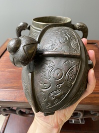 A Chinese archaic bronze ritual wine vessel and cover in Western Zhou-style, 'you', Ming