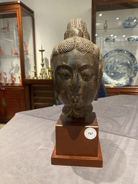A Chinese brown-grey limestone head of Bodhisattva, probably Tang