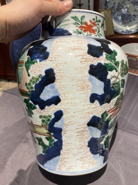 A Chinese wucai vase and cover with narrative design, Transitional period