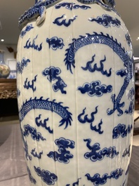 A pair of Chinese blue and white 'dragon' vases, 19th C.