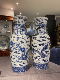 A pair of Chinese blue and white 'dragon' vases, 19th C.