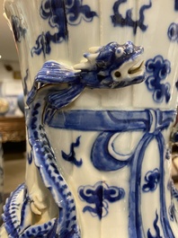 A pair of Chinese blue and white 'dragon' vases, 19th C.