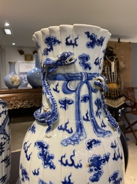 A pair of Chinese blue and white 'dragon' vases, 19th C.