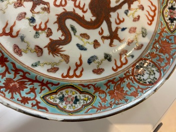 A large Chinese blue and white 'lotus scrolls' bowl and three famille rose plates, 19/20th C.