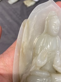 A Chinese white jade sculpture of Guanyin on a lotus throne, Qing