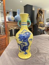 A Chinese blue and white yellow-ground 'dragon' vase with green-glazed handles on a jade-inset wooden stand, Jiaqing mark, 19/20th C.