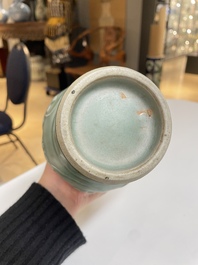 Een Chinese Longquan celadon vaas met pioenslingers, Yuan