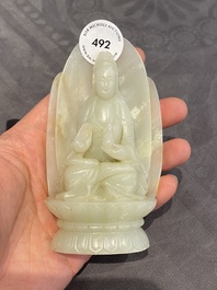 A Chinese white jade sculpture of Guanyin on a lotus throne, Qing