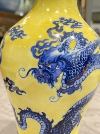 A Chinese blue and white yellow-ground 'dragon' vase with green-glazed handles on a jade-inset wooden stand, Jiaqing mark, 19/20th C.