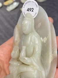 A Chinese white jade sculpture of Guanyin on a lotus throne, Qing