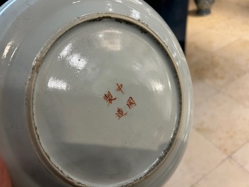 A large Chinese blue and white 'lotus scrolls' bowl and three famille rose plates, 19/20th C.