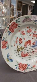 A Chinese famille rose dish and two plates, Yongzheng/Qianlong