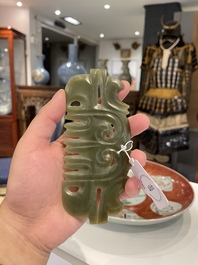 A Chinese spinach jade pendant in Hongshan-style, Qing