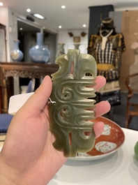 A Chinese spinach jade pendant in Hongshan-style, Qing