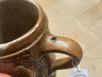 An unusual German stoneware mug depicting king Gambrinus, Cologne or Frechen, ca. 1600