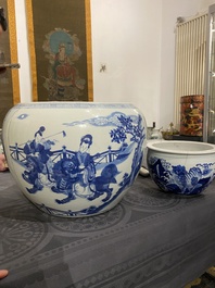 Two Chinese blue and white fish bowls or jardini&egrave;res with figurative design and mythical animals, 19/20th C.