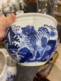 Two Chinese blue and white fish bowls or jardini&egrave;res with figurative design and mythical animals, 19/20th C.