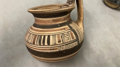 Two geometrical decorated Daunian pottery vessels and an olive press, Southern Italy, 6th/3rd C. b.C.