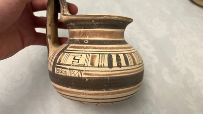 Two geometrical decorated Daunian pottery vessels and an olive press, Southern Italy, 6th/3rd C. b.C.