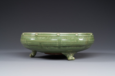 A Chinese Longquan celadon tripod censer on wooden stand, Yuan/Ming