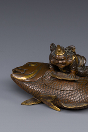 A Japanese parcel-gilt bronze lidded box in the shape of Ebisu on sea bream, signed Miyao Zo, Meiji, around 1880