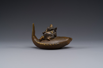 A Japanese parcel-gilt bronze lidded box in the shape of Ebisu on sea bream, signed Miyao Zo, Meiji, around 1880