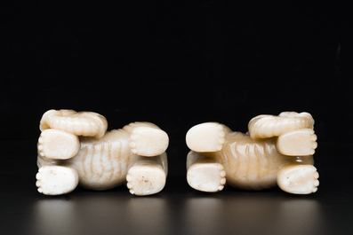 A pair of Chinese white and russet jade sculptures of elephants, Qianlong